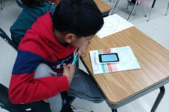 Baibhav (native Japanese speaker) learning how to use a graphic organizer with help of Pocket Talk.