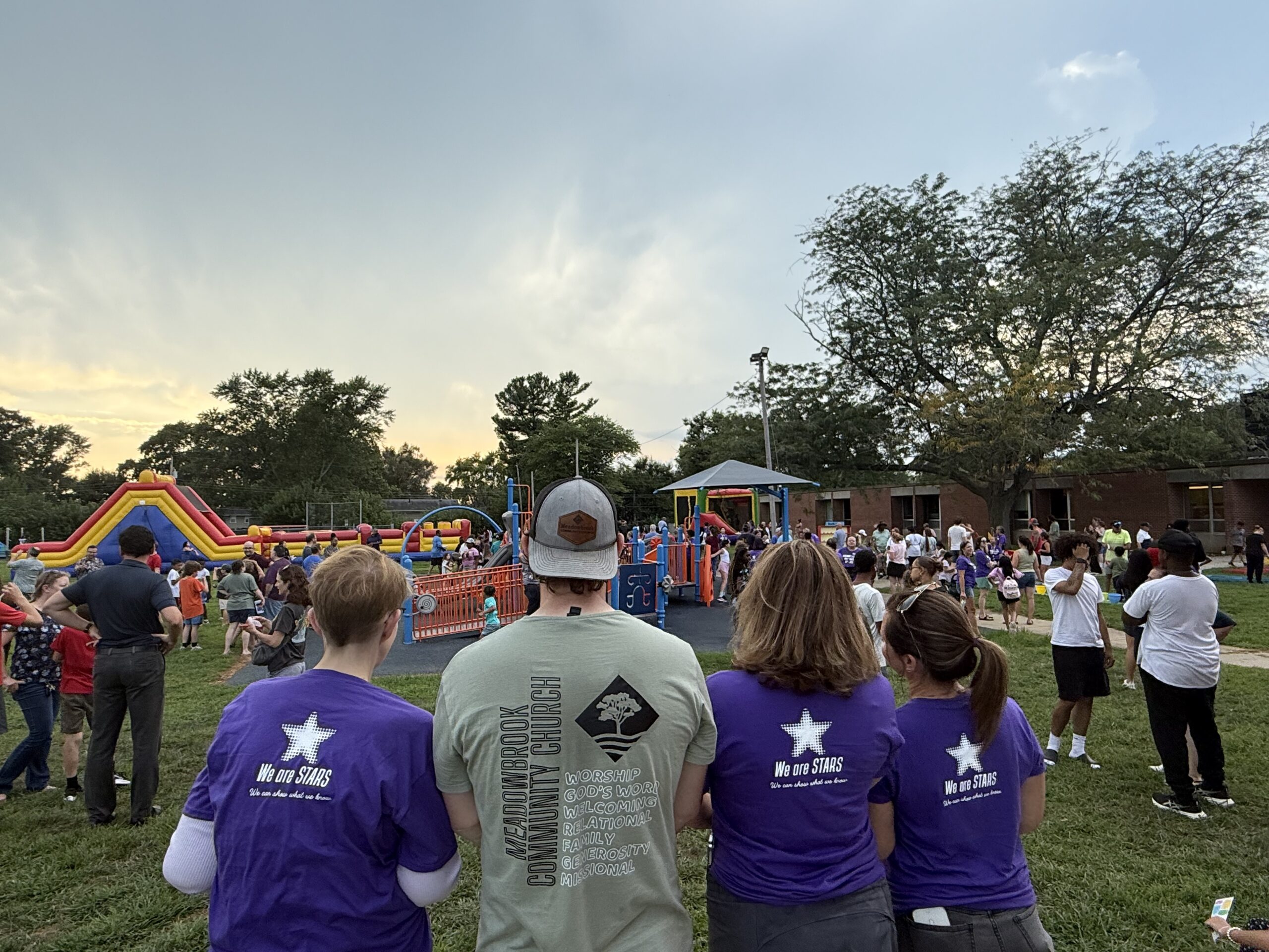 Kenwood and Meadowbrook staff surveying the back to school picnic together